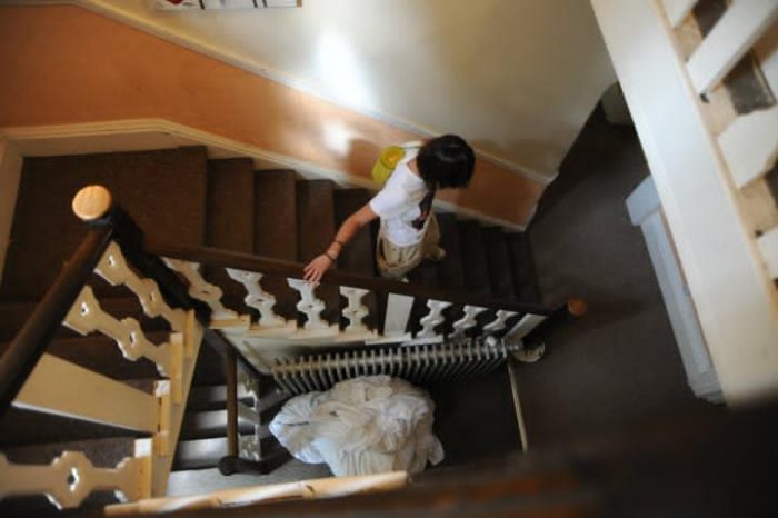 Girl climbing down the stairs